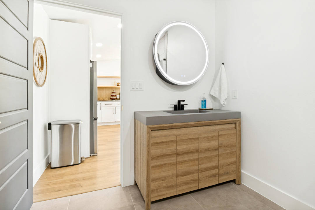 ingleside pool house bathroom vanity round mirror
