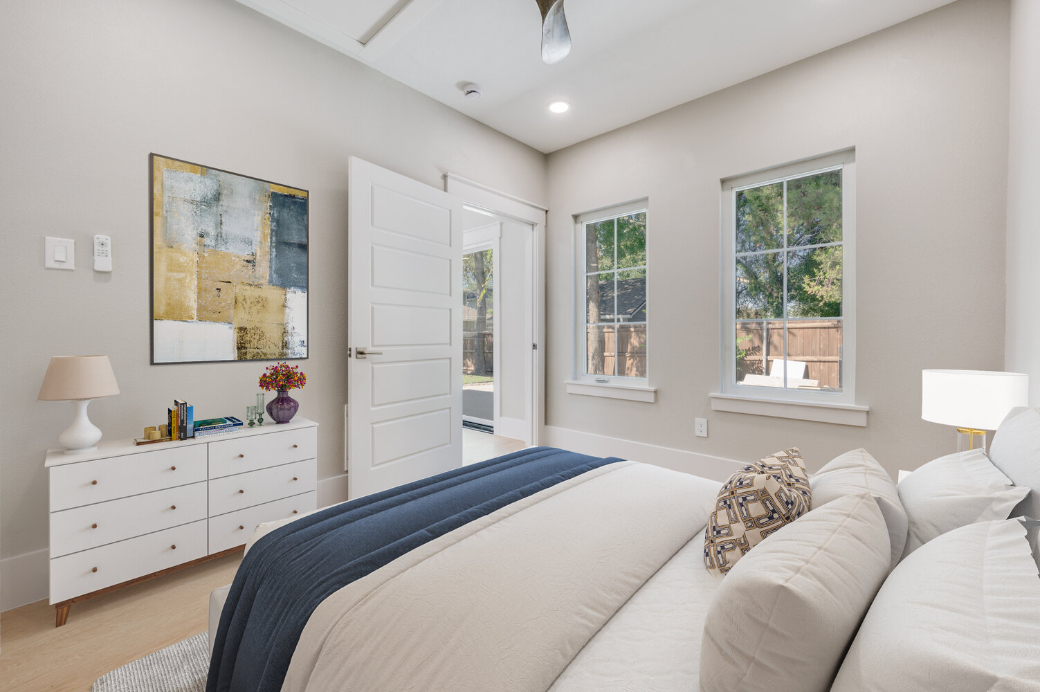 Cozy custom bedroom in Dallas ADU by Estate ADU with neutral decor and modern furnishings.
