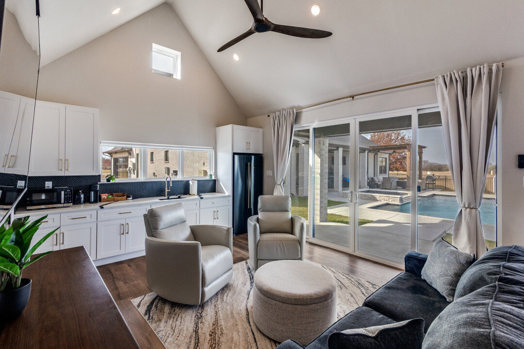 Open-concept ADU kitchen and living space with white cabinetry by Estate ADU in Denton, TX.